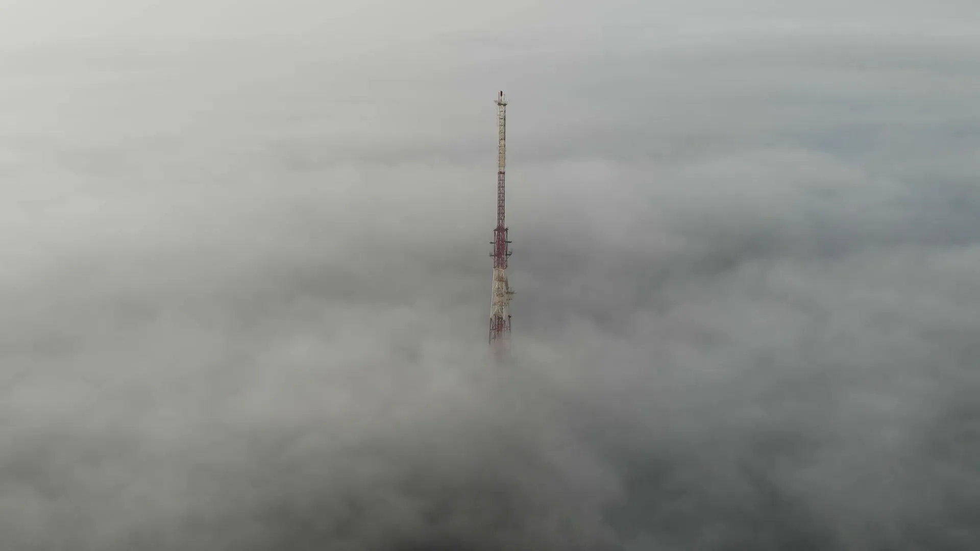 Communications infrastructure rising above a layer of low cloud